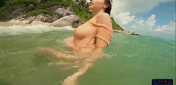  Big natural tits MILF Niemira strips on a sunny island